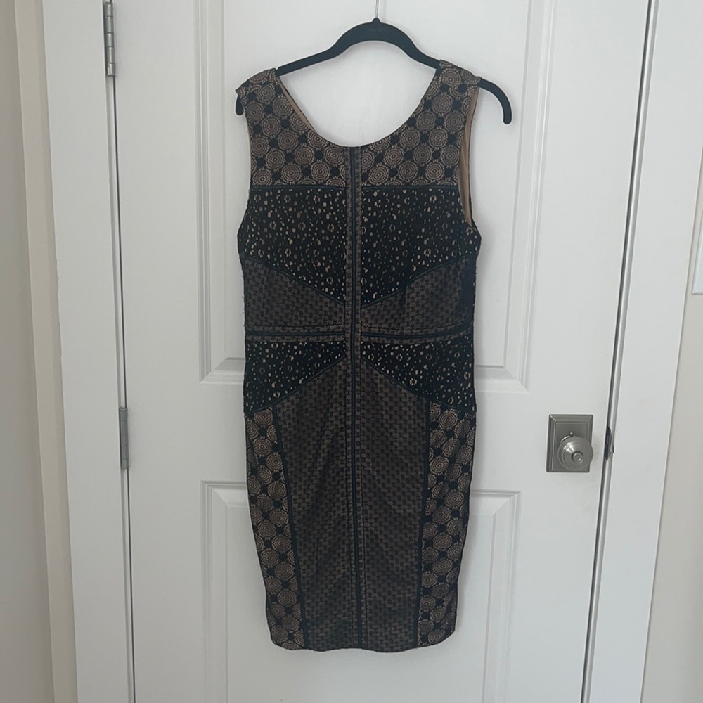Black and nude dress with leather accents